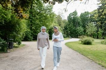 House of Hearing Mt Pleasant Utah - Two muslim women walking in the park.