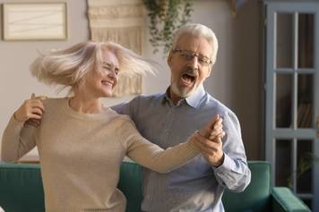 House of Hearing Mt Pleasant Utah - An older couple dancing in their living room.